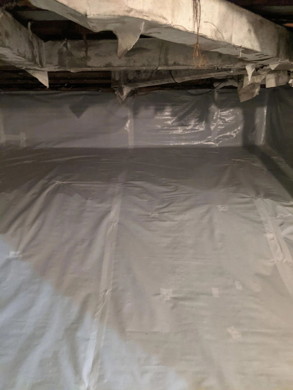 Sheet covered with plastic to avoid wetting of floor