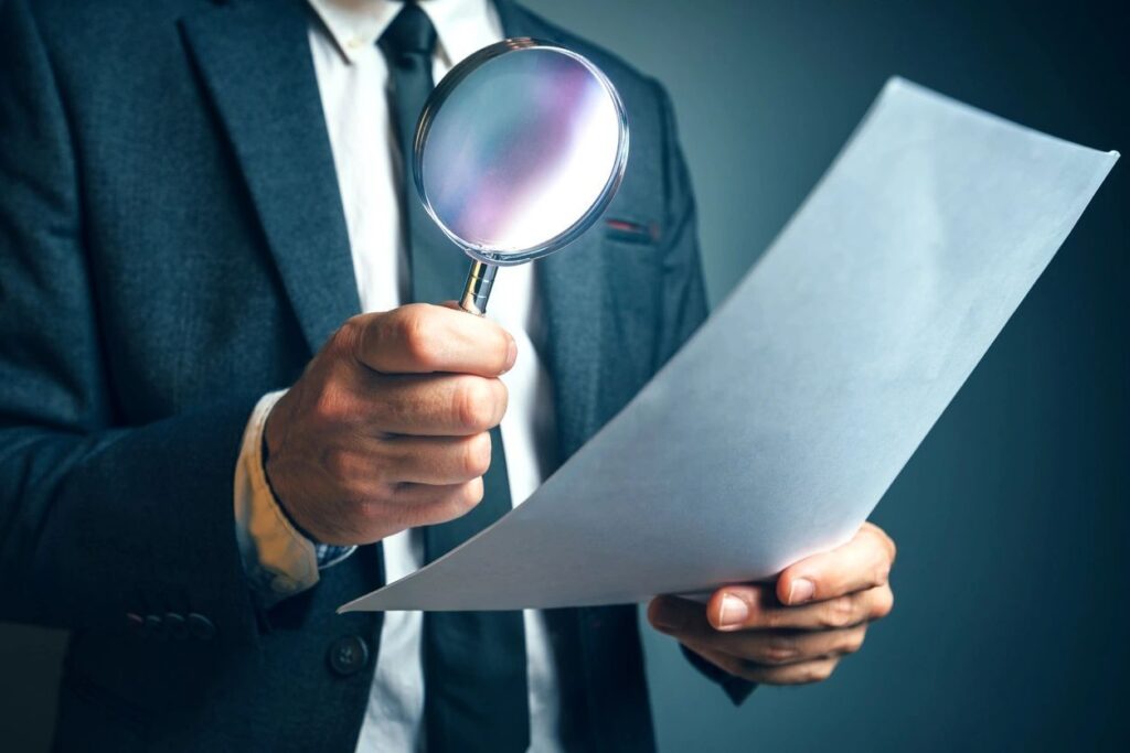 Man searching with magnifying glass